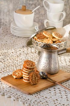 Caramel Florentines cookies on a wooden cutting board. From series Italian Desserts