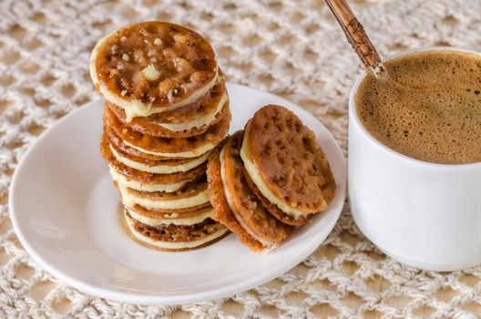 Caramel Florentines cookies on a wooden cutting board. From series Italian Desserts