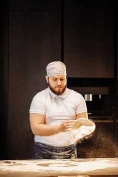 Making dough by hands at bakery or at home.