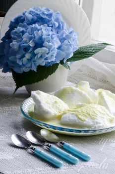 Beaten egg whites with butter cream and hydrangea. Next three teaspoons