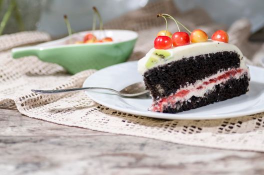 Bird-cherry flour cake with cherries, strawberries and kiwi. Homemade cake. From series "bird-cherry cake"