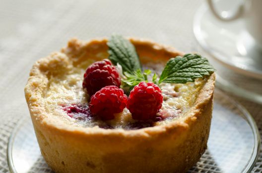 Mini berry tarts decorated with Mini berry tarts decorated with raspberries