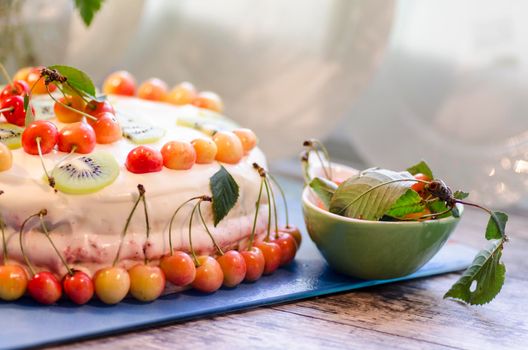 Bird-cherry flour cake with cherries, strawberries and kiwi. Homemade cake. From series "bird-cherry cake"