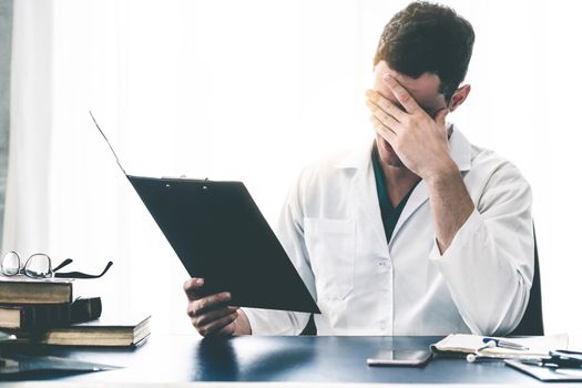 Doctor working in hospital office. Medical healthcare concept.