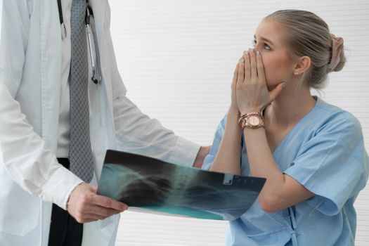 Doctor and unhappy patient at hospital or medical clinic . Healthcare medical malpractice and failure concept.