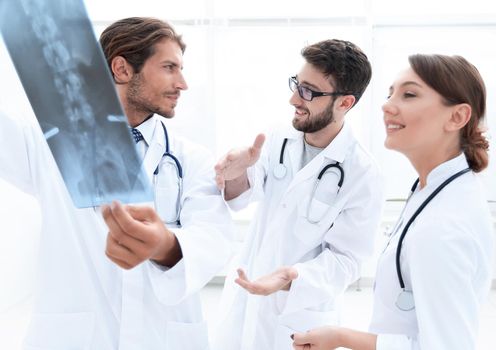 Healthcare, medical and radiology concept - doctors looking at x-ray