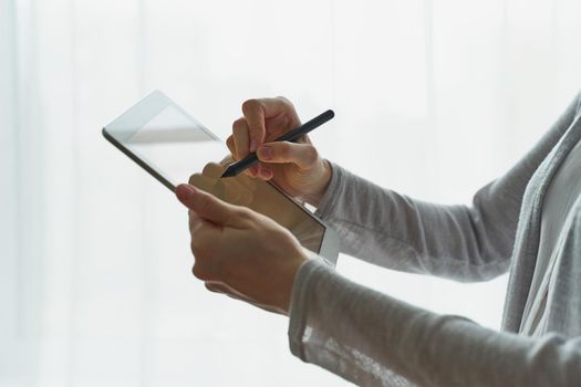 person signing the document on device, concept of e-signature, modern