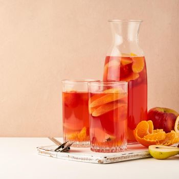 Multivitamin mocktail with fresh and ripe fruits, healthy compote for vegetarians