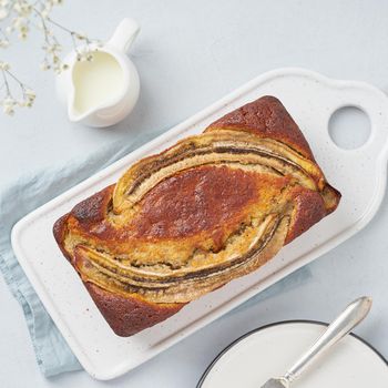 Whole Banana bread. Cake with banana and walnut. Traditional american cuisine. Top view, close up