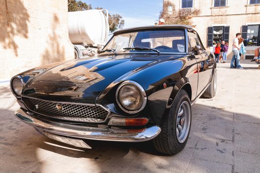 MALTA, RABAT - February 24, 2010. Beautiful old timer parked on street. Old fashioned black Fiat.