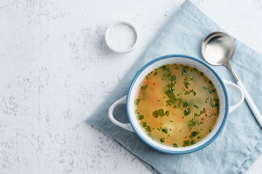 chicken soup, scandinavian homemade food with on a blue stone table, copy space, top view