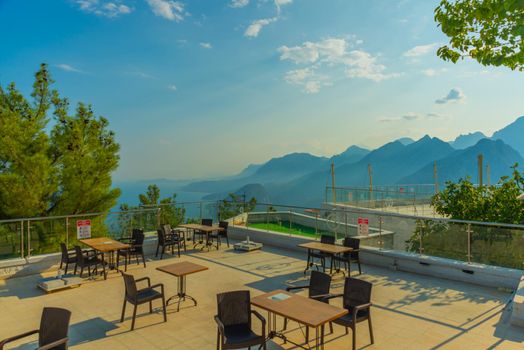 ANTALYA, TURKEY: Cafe at the top of the Cable car on Mount Tyunektepe on a sunny summer day. There are observation decks at the top. The upper station is built at an altitude of 605 m.