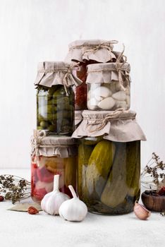 jars arrangement with picked vegetables