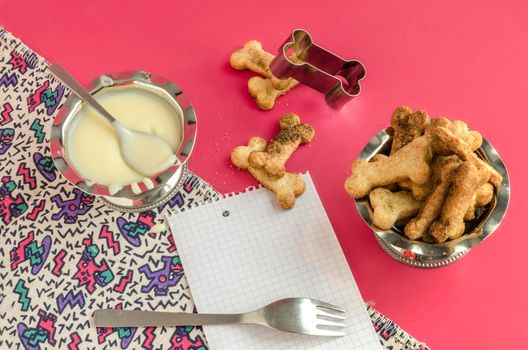 Bone sugar cookies and condensed milk, background for menu From series kids baking recipes