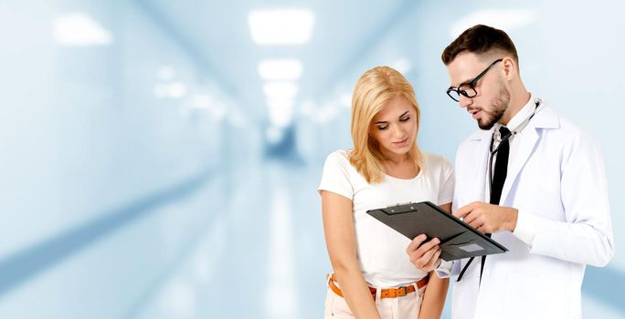 Doctor talking to patient in the hospital. The happy patient is listening to explanation from the doctor. Concept of medical healthcare and doctor staff service.