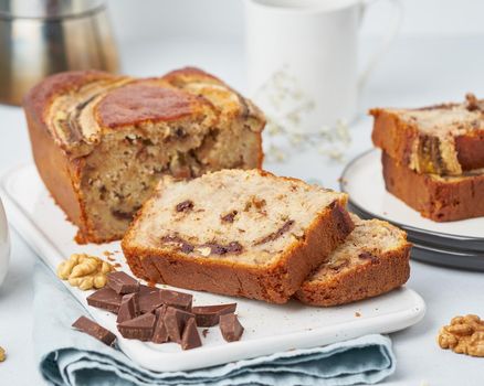 Banana bread. A cake with banana, chocolate, walnut. Traditional american cuisine. Side view