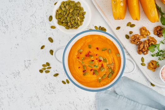 healthy lunch for vegetarians, cream soup with walnuts and pumpkin seeds