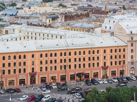 SAINT-PETERSBURG, RUSSIA - August 14, 2021. People walking past famous hotels Angleterre and Astoria, view Saint Isaac's Cathedral or Isaakievskiy Sobor.