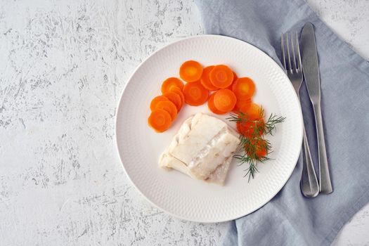 steamed codfish full of vitamins with carrot and dill, healthy diet, fodmap dash and paleo