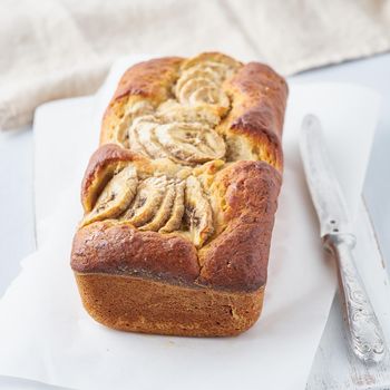 Banana bread, cake with banana. The morning Breakfast on a light grey background