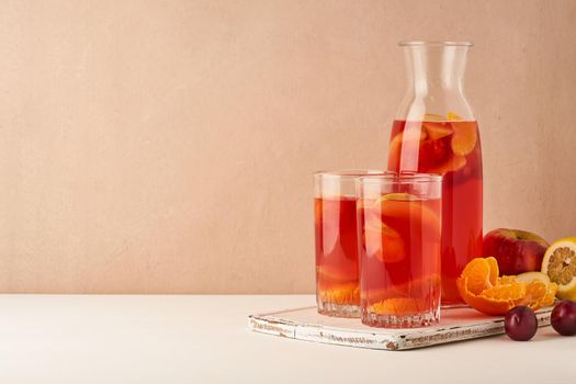 Multivitamin mocktail with fresh and ripe fruits, healthy compote for vegetarians