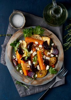 Vegetarian salad ricotta cheese, baked roasted vegetables, keto ketogenic dash diet. Mix of carrots, beets, turnips, rutabaga, onions and nuts. Clean eating. Vertical