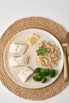 healthy meal full of vitamins and minerals, cod and rice with broccoli
