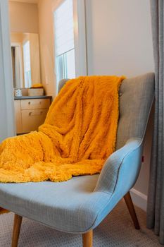 Giant orange Plaid Blanket Woolen Knitted on White Chair Home Scandinavian Style