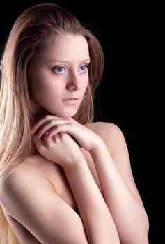 Beauty young naked girl look at light in dark