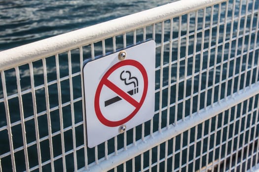 Sign on the metal fence Do not smoke