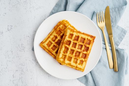 Chaffle, ketogenic diet health food. Homemade keto waffles with egg, mozzarella cheese. Gluten - free and carb-free. White background.