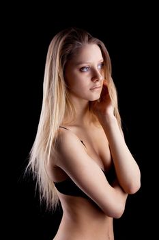 Young blond girl with long hair in lingerie