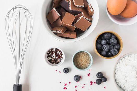 ingredients making cake with whisk white background