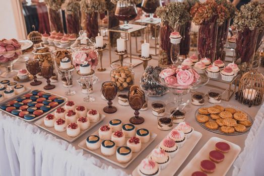 Table with food for the holiday. Cuisine. Culinary Buffet. Dinner Catering. Dining Food. Celebration Party. Concept wedding birthday. Sweet pastries desserts