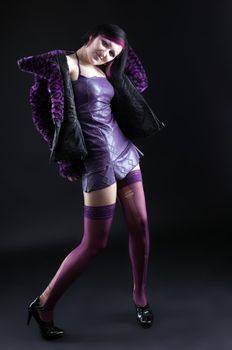 Young girl in purple fur coat - gothic style make up