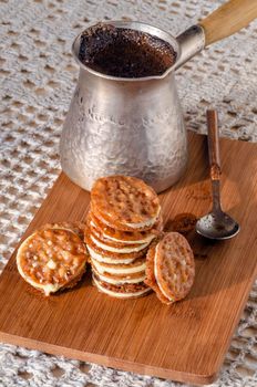 Caramel Florentines cookies on a wooden cutting board. From series Italian Desserts