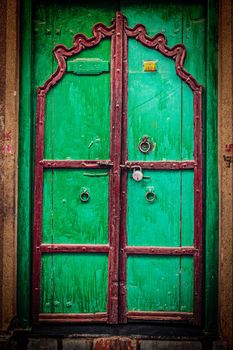 Retro hipster styled image of wooden old door vintage texture background