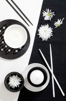 White porcelain on black and white linen tablecloths. White porcelain on black and white linen tablecloths. Abstract still life. From series "Playing with Color"