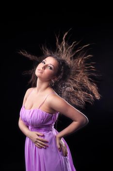 young girl with long hair under wind