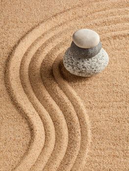 Japanese Zen stone garden - relaxation, meditation, simplicity and balance concept - pebbles and raked sand tranquil calm scene