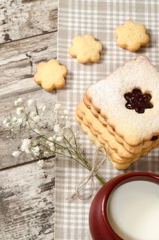 Homemade sugar cookies with jam decorated with flowers. From the series Homemade Bakery