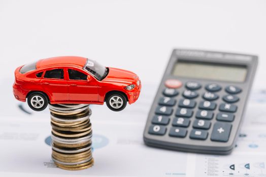 toy car coin stack with calculator report