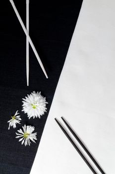 White porcelain on black and white linen tablecloths. White porcelain on black and white linen tablecloths. Abstract still life. From series "Playing with Color"