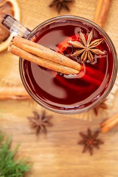 Christmas mulled wine. Merry Christmas. Glass of mulled wine with cinnamon and anise, top view. Selective focus.Holiday