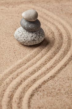 Japanese Zen stone garden - relaxation, meditation, simplicity and balance concept - pebbles and raked sand tranquil calm scene