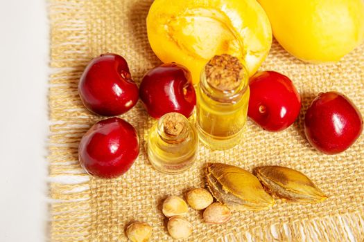 apricot and cherry oil in a small jar. selective focus.nature