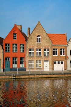 Typical Belgian cityscape Europe tourism concept - canal and old houses on sunset. Bruges (Brugge), Belgium