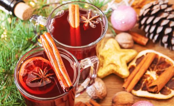 Christmas mulled wine. Merry Christmas. Glass of mulled wine with cinnamon and anise, top view. Selective focus.Holiday