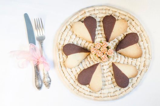 Cookies in shape of heart on plate, white background. From series "Valentine's Day"