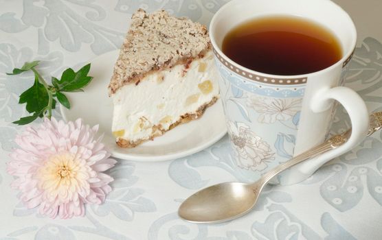 Ricotta and Pear Cake with cup of tea and bouquet of chrysanthemums. From the series "Italian desserts"